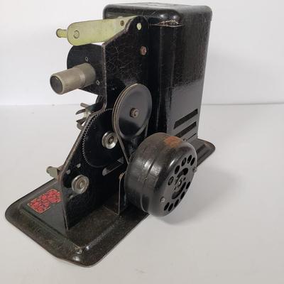 LOT 92L: Lindstrom 16mm Projector with Mutt & Jeff, Charlie Chaplin, Ken Maynard Reels
