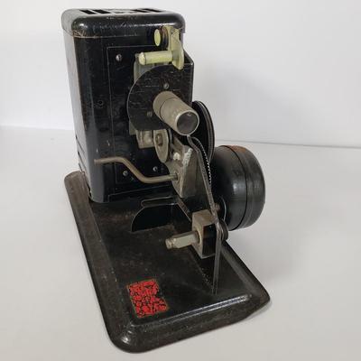 LOT 92L: Lindstrom 16mm Projector with Mutt & Jeff, Charlie Chaplin, Ken Maynard Reels