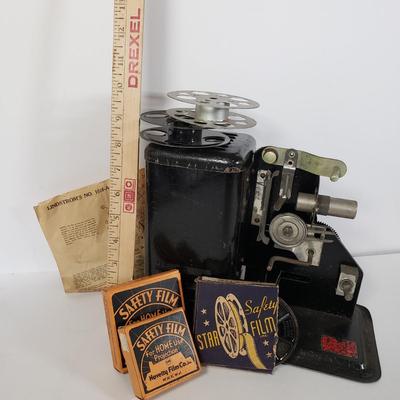 LOT 92L: Lindstrom 16mm Projector with Mutt & Jeff, Charlie Chaplin, Ken Maynard Reels