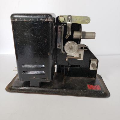 LOT 92L: Lindstrom 16mm Projector with Mutt & Jeff, Charlie Chaplin, Ken Maynard Reels