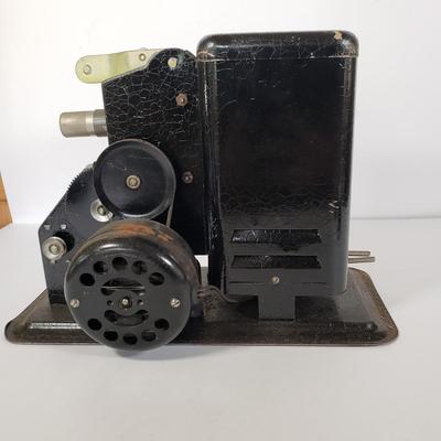 LOT 92L: Lindstrom 16mm Projector with Mutt & Jeff, Charlie Chaplin, Ken Maynard Reels