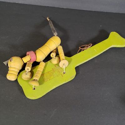LOT 99L: Disney Fisher Price Pluto Pop Up, Monkey Jester Flip Toy, and Hand Carved Movable Wooden Toys