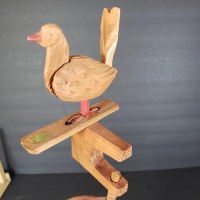 LOT 99L: Disney Fisher Price Pluto Pop Up, Monkey Jester Flip Toy, and Hand Carved Movable Wooden Toys