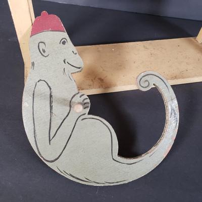 LOT 99L: Disney Fisher Price Pluto Pop Up, Monkey Jester Flip Toy, and Hand Carved Movable Wooden Toys