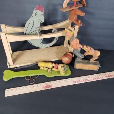 LOT 99L: Disney Fisher Price Pluto Pop Up, Monkey Jester Flip Toy, and Hand Carved Movable Wooden Toys