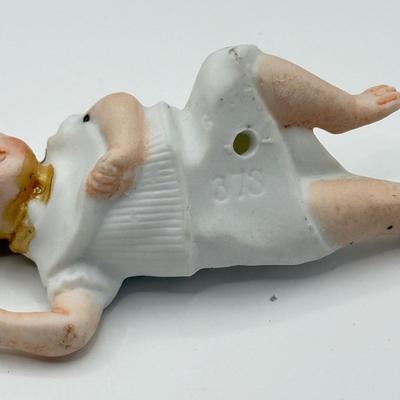 LOT 119K: Vintage Wind Up Tin Litho Toy & Ceramic Babies