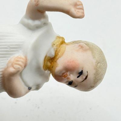 LOT 119K: Vintage Wind Up Tin Litho Toy & Ceramic Babies