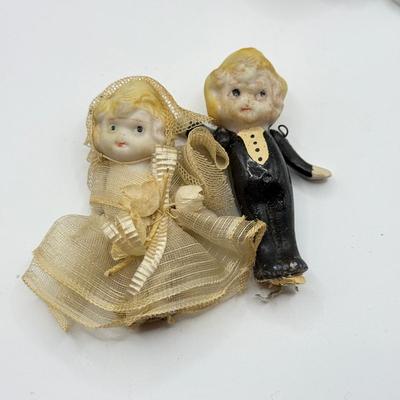 LOT 119K: Vintage Wind Up Tin Litho Toy & Ceramic Babies