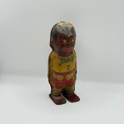 LOT 119K: Vintage Wind Up Tin Litho Toy & Ceramic Babies