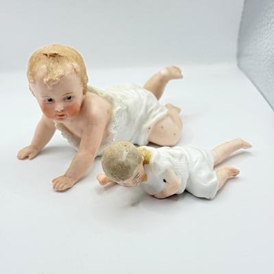 LOT 119K: Vintage Wind Up Tin Litho Toy & Ceramic Babies