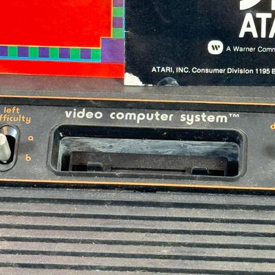 LOT 137L: Vintage 1980s Atari Video Computer System Model CX-2600 w/ Manual, 2 Joysticks, 2 Paddles, Power Cord & 4 Games w/...