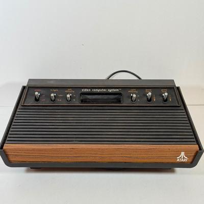 LOT 137L: Vintage 1980s Atari Video Computer System Model CX-2600 w/ Manual, 2 Joysticks, 2 Paddles, Power Cord & 4 Games w/...