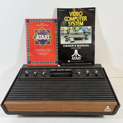 LOT 137L: Vintage 1980s Atari Video Computer System Model CX-2600 w/ Manual, 2 Joysticks, 2 Paddles, Power Cord & 4 Games w/...