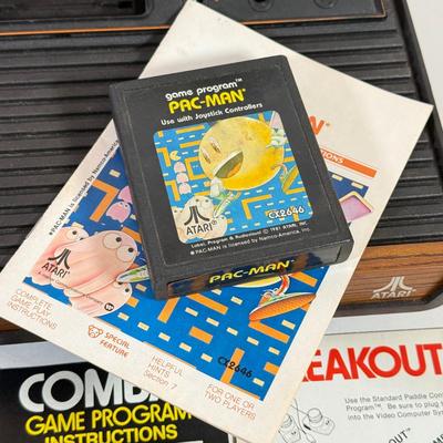 LOT 137L: Vintage 1980s Atari Video Computer System Model CX-2600 w/ Manual, 2 Joysticks, 2 Paddles, Power Cord & 4 Games w/...