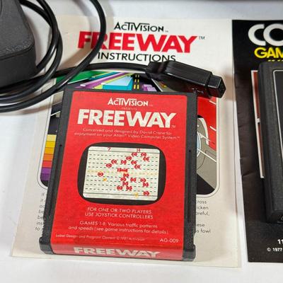 LOT 137L: Vintage 1980s Atari Video Computer System Model CX-2600 w/ Manual, 2 Joysticks, 2 Paddles, Power Cord & 4 Games w/...