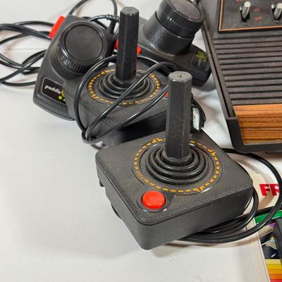 LOT 137L: Vintage 1980s Atari Video Computer System Model CX-2600 w/ Manual, 2 Joysticks, 2 Paddles, Power Cord & 4 Games w/...