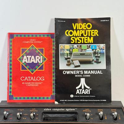 LOT 137L: Vintage 1980s Atari Video Computer System Model CX-2600 w/ Manual, 2 Joysticks, 2 Paddles, Power Cord & 4 Games w/...