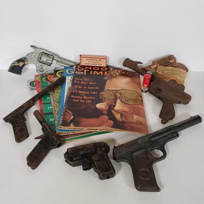 LOT 150L: Vintage Toy Guns & Accessories with 1960s Gun Sport Magazines