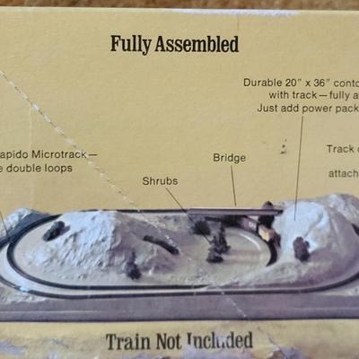 LOT 183L: Vintage Revell Fully Assembled N-Gauge MicroTrain 'Rocky Mountain' Decorated Layout Toy in Orignal Box
