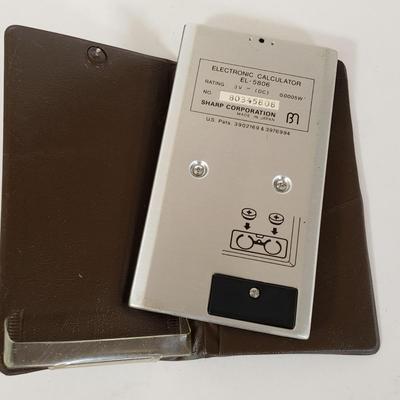 LOT 211L: Vintage Calculators; Sharp Elsi Mate & Texas Instruments