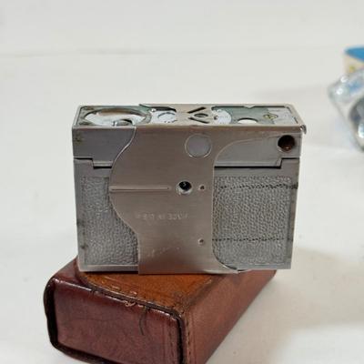 LOT 221L: Vintage Polaroid Pronto Land Camera w/ Flash Bars & More