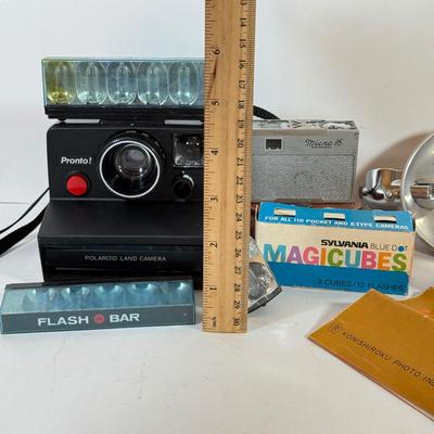LOT 221L: Vintage Polaroid Pronto Land Camera w/ Flash Bars & More