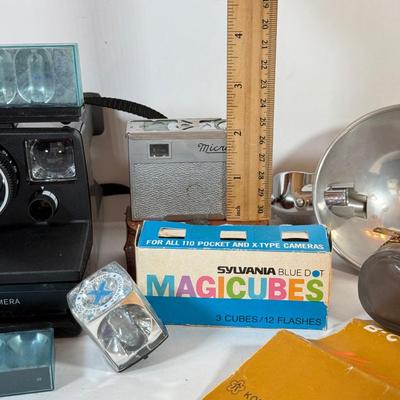 LOT 221L: Vintage Polaroid Pronto Land Camera w/ Flash Bars & More