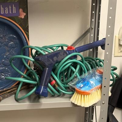 Sale Photo Thumbnail #1198: One Spiral Garden Hose, royal blue glazed bird bath, Chemical hose nossle, brush nossle, four wrought iron lawn decor
Bird Bath: 16" diameter