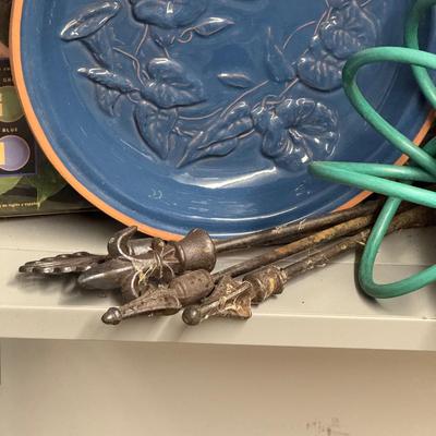 Sale Photo Thumbnail #1197: One Spiral Garden Hose, royal blue glazed bird bath, Chemical hose nossle, brush nossle, four wrought iron lawn decor
Bird Bath: 16" diameter