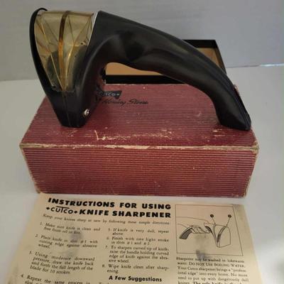 Vintage Cutco cutlery with holder and Cutco knife sharpener