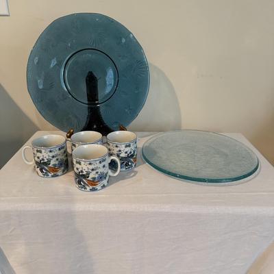 Sale Photo Thumbnail #1435: Comes with two large glass plates. Also four matching mugs
Dark blue plate is 12.5.“ in diameter
Light blue plate is 11.5” in diameter