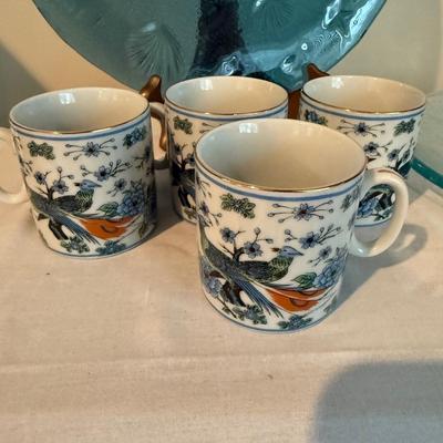 Sale Photo Thumbnail #1437: Comes with two large glass plates. Also four matching mugs
Dark blue plate is 12.5.“ in diameter
Light blue plate is 11.5” in diameter