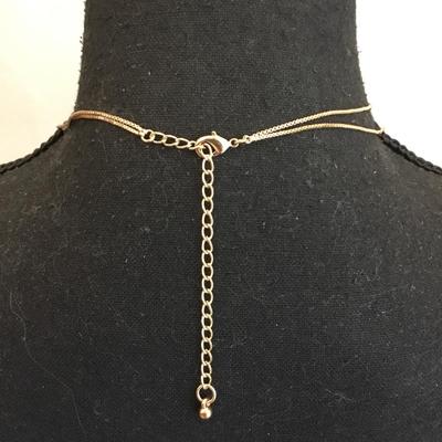 Beautiful cool toned, layered cross, and coin necklace