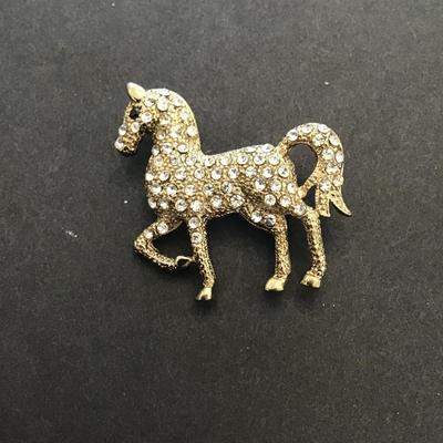 Vintage, gold tone, horse lapel pin with rhinestones
