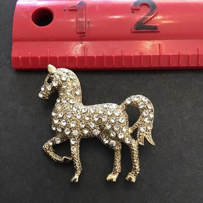 Vintage, gold tone, horse lapel pin with rhinestones