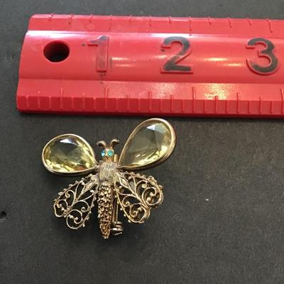 Vintage brushed gold tone, butterfly with champagne colored rhinestones