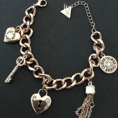 Cute rose, gold, toned, guess charm bracelet excellent condition