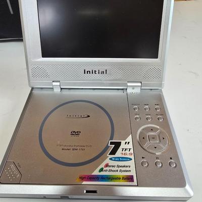 LOT 74P: Retro Road Trip!! Magellan GPS with Portable DVD Player, CD Player, and Accessories