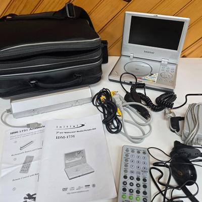 LOT 74P: Retro Road Trip!! Magellan GPS with Portable DVD Player, CD Player, and Accessories