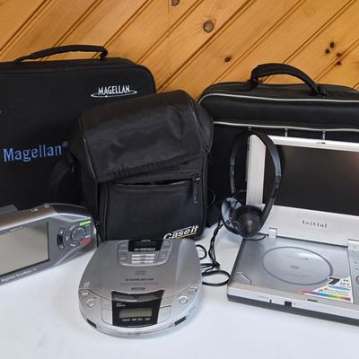 LOT 74P: Retro Road Trip!! Magellan GPS with Portable DVD Player, CD Player, and Accessories