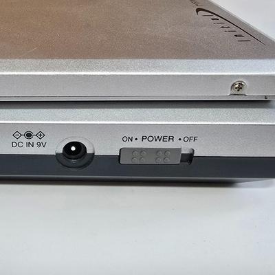 LOT 74P: Retro Road Trip!! Magellan GPS with Portable DVD Player, CD Player, and Accessories