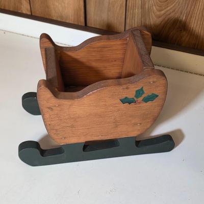 LOT 104S: Beautiful Christmas items, Includes Handmade Quilt Wall Hanging, Wooden Sled, Jar Of Jingle Bells & More