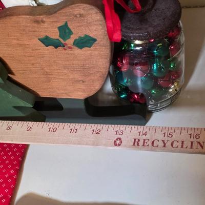 LOT 104S: Beautiful Christmas items, Includes Handmade Quilt Wall Hanging, Wooden Sled, Jar Of Jingle Bells & More