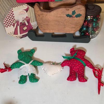 LOT 104S: Beautiful Christmas items, Includes Handmade Quilt Wall Hanging, Wooden Sled, Jar Of Jingle Bells & More