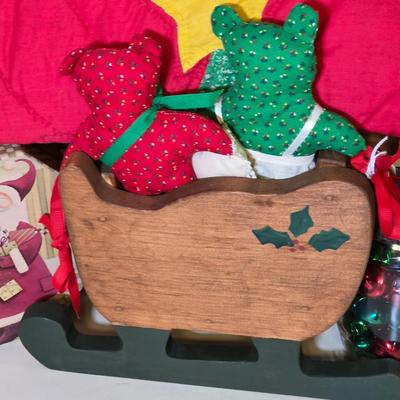 LOT 104S: Beautiful Christmas items, Includes Handmade Quilt Wall Hanging, Wooden Sled, Jar Of Jingle Bells & More