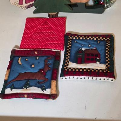 LOT 104S: Beautiful Christmas items, Includes Handmade Quilt Wall Hanging, Wooden Sled, Jar Of Jingle Bells & More