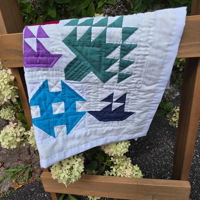 LOT 120S: Leaning Ladder W/Vintage Handmade Table Runner & Quilts