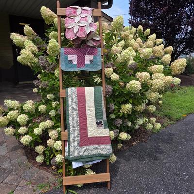 LOT 120S: Leaning Ladder W/Vintage Handmade Table Runner & Quilts