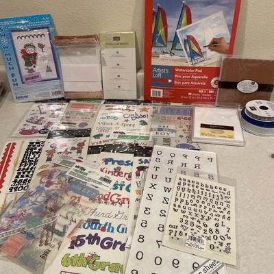 Stickers, watercolor, and ribbon