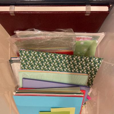 Tote with miscellaneous crafting paper and photo albums